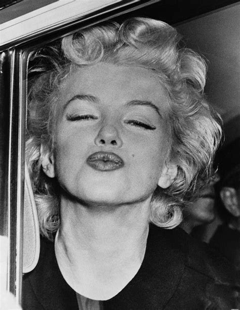 Marilyn Monroe Looking Out The Window Of A Car With Her Eyes Closed And