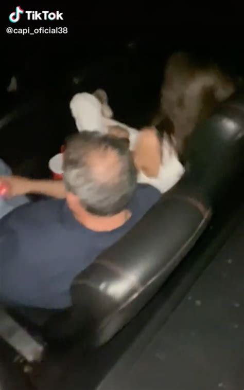 Man Peacefully Watches Movie With Mistress Until Wife Appears Behind Him