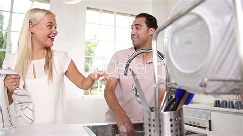 Joyful Couple Washing Dishes Together Lizenzfreie Stock Videos Und Clips