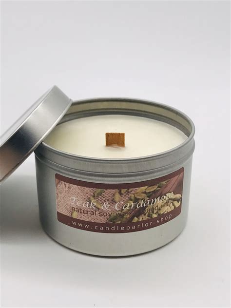 teak and cardamon scented soy wax candle with wood wick 6 oz tin