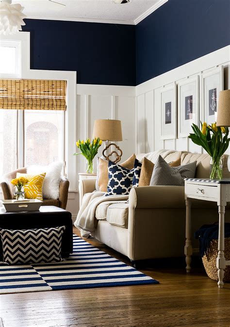 Paint the surrounding walls fleet dejected to bout the headboard bank for an intimate, comfortable feeling. Spring Decor Ideas in Navy and Yellow | Navy living rooms, Navy blue living room, Coastal living ...