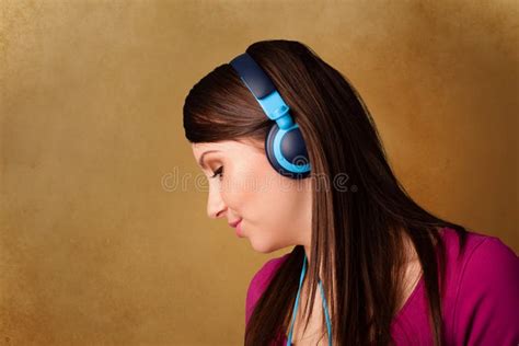 Young Woman With Headphones Listening To Music With Copy Space Stock
