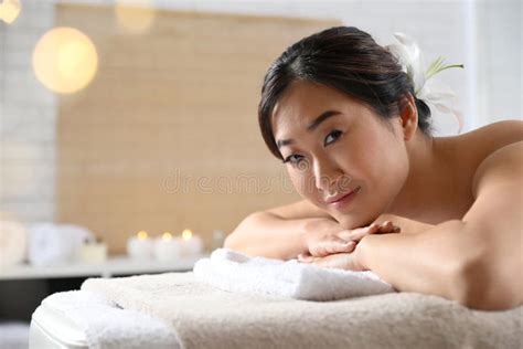 Beautiful Asian Woman Lying On Massage Table In Spa Salon Stock Image Image Of Oriental