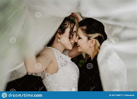 beautiful hispanic lesbian couple in a photo section for their wedding stock image image of