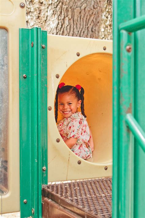 Young Latina Girl On Playground By Stocksy Contributor Jayme Burrows Stocksy