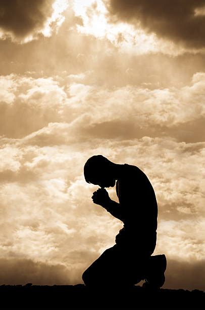 Kneeling In Prayer Stock Photos Pictures And Royalty Free Images Istock