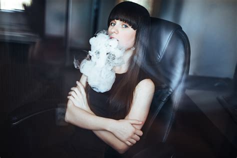 Portrait Of Fashion Young Vaping Girl Girl Blowing Vape On Her