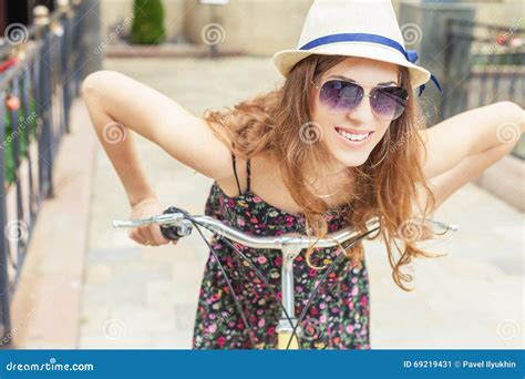 Closeup Woman Riding By Vintage City Bicycle At City Center Stock Image