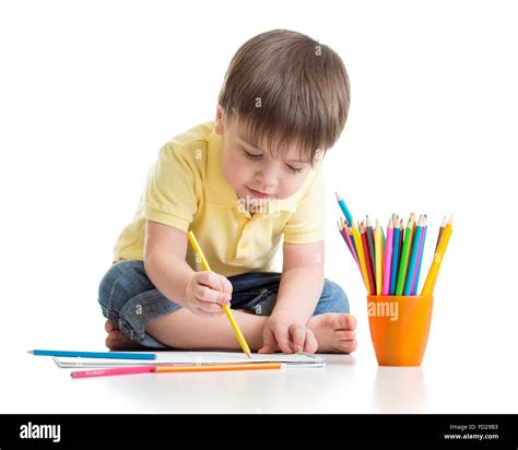 Cute Child Boy Drawing With Pencils In Preschool Isolated Stock Photo