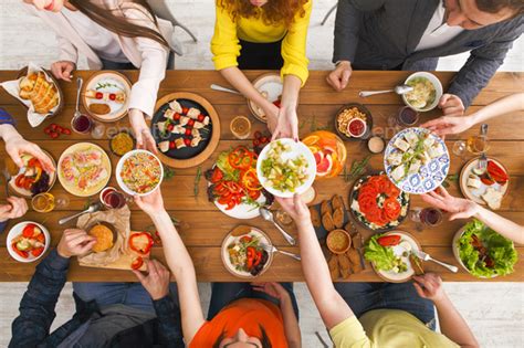 From calorie counting to reducing sugar or salt intake, it can be tricky to navigate a. People eat healthy meals at served table dinner party ...