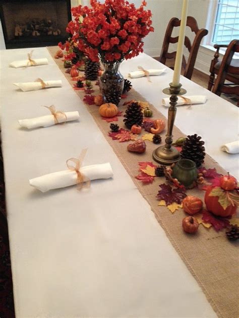 The Table Is Set With Candles And Place Settings