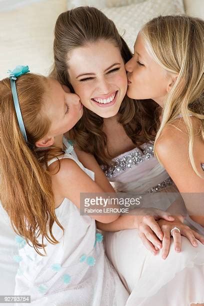 blonde brunette girls kiss photos and premium high res pictures getty images