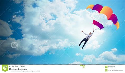 The Young Businessman Falling On Parachute In Business Concept Stock