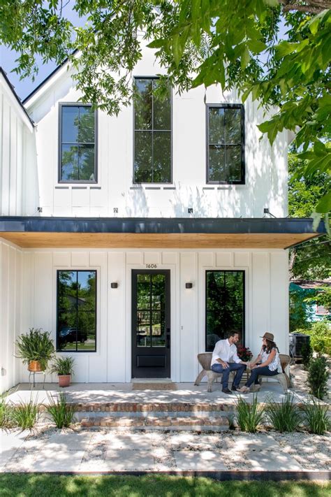 This home has the thoughtful idea of adding vertical cladding to its exterior wall. Modern Farmhouse Exterior Ideas and Inspiration | Hunker