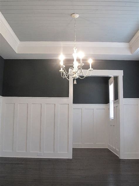 The ultimate guide to wainscoting. high wainescotting, white chandelier, coffered ceilings ...