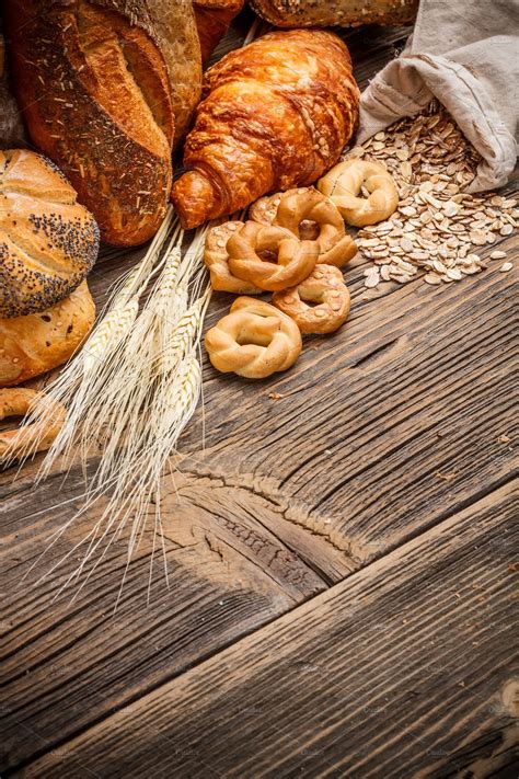 Assortment of baked bread containing assortment, background, and bakery | High-Quality Food ...