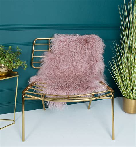The Pink Sheepskin Rug Here Paired With The Super Gold Chair Is A