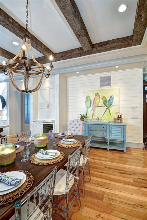Coastal Style Dining Room With Exposed Beams And Nautical Chandelier