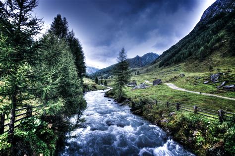 River Between Trees And Mountain · Free Stock Photo