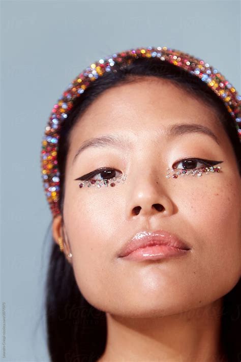 Gorgeous Asian Woman In Glitter And Stones Makeup By Stocksy