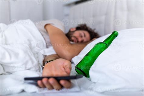 Texting While Drunk Concept Young Man Lying In Bed Deadly Drunken