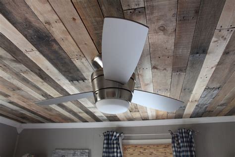 Installing your own ceiling, whether it is the look of a new wood ceiling or a more traditional panel, can be a daunting task. Remodelaholic | Rustic Pallet Wood Ceiling Tutorial