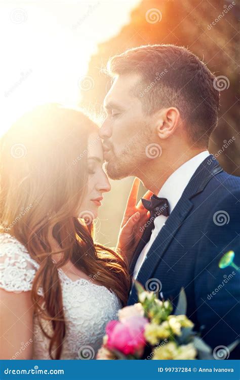 Beautiful Couple In Love Kissing In Close Up Wedding Couple Kissing At Sunset And Waves Of Love