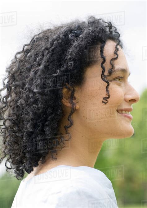 Young Woman Smiling Side View Portrait Stock Photo Dissolve