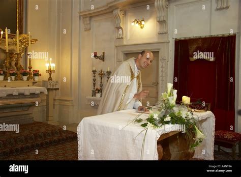 Priest Standing At Altar Stock Photo Alamy