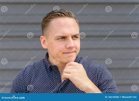 Thoughtful Young Man With His Hand To His Chin Stock Photo Image Of