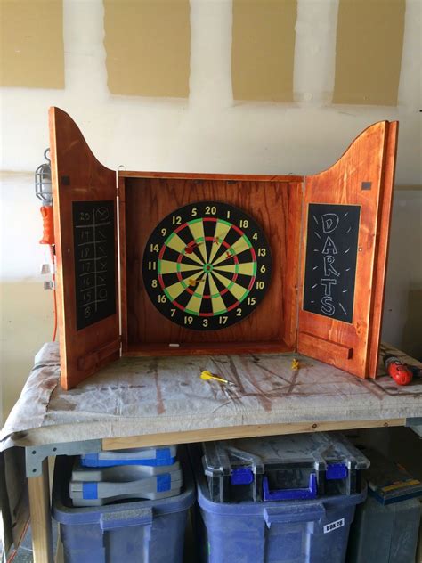 To finish the cabinet off, use the screen molding to hide the plywood panel, attach the cabinet to the wall and mount your dartboard! Dartboard Cabinet Stand | Dart board cabinet, Dartboard ...