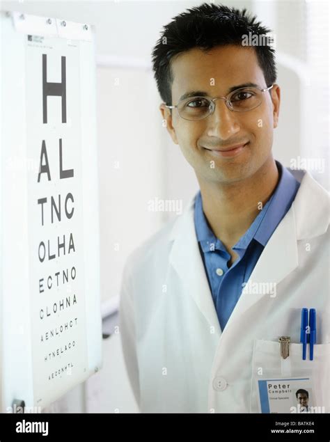 Optometrist Next To An Eyechart The Eye Chart Is Used To Test A Person