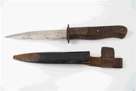 A Wwii German Trench Knife With Wooden Handle And Metal Sheath 29cm