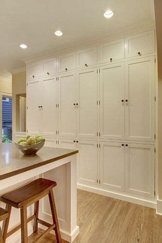 The marble checkerboard floor and black cabinets make this laundry room unusually elegant. Floor to ceiling cabinets | H O M E | Pinterest