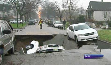Massive Sinkhole Swallows 3 Cars Injures One Driver After Water Main