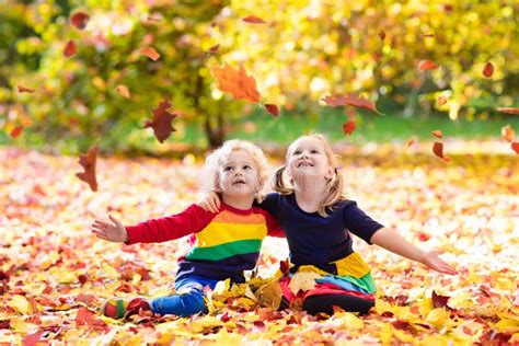 Kids Play In Autumn Park Children In Fall Stock Photo Image Of