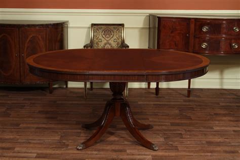 Be the first to write a review. High End Mahogany Dining Table in a Walnut Finish 48 to 66