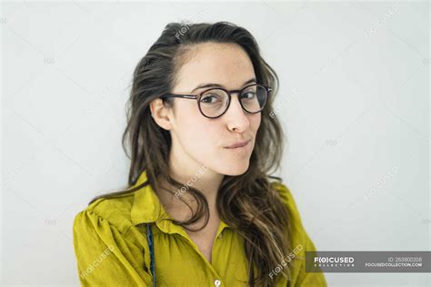 Portrait Of Young Woman Wearing Glasses — Looking At Camera Sceptical