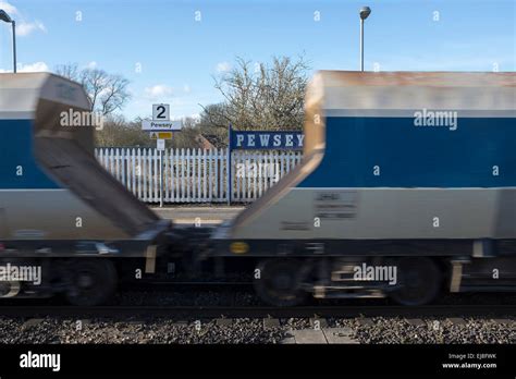 Freight Train Passing Through Pewsey Railway Station Wiltshire Stock