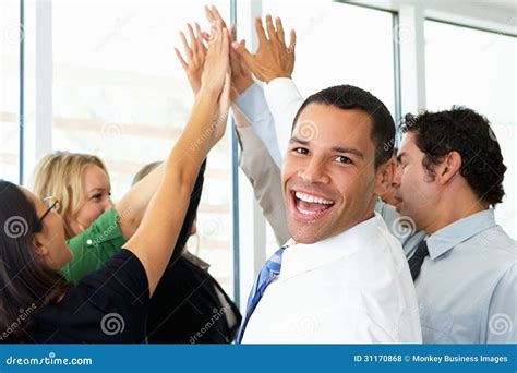 Business Team Giving One Another High Five Stock Photo Image Of Five