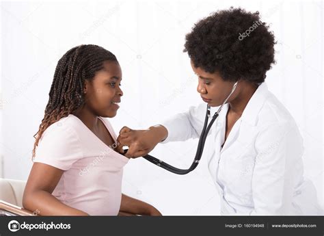 Female Doctor Examining Patient Stock Photo By ©andreypopov 160194948