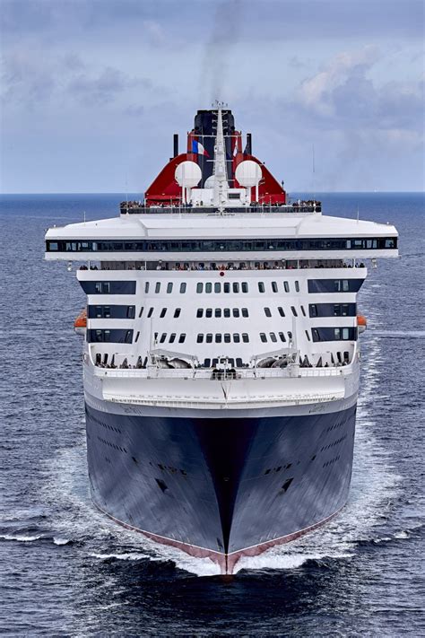Queen mary 2 boasts 14 spacious decks with sweeping staircases and magnificent public rooms entertainment is easily derived from the queen mary 2's many swimming pools, lounges, shops and. Photos - Queen Mary 2 - Queen Mary 2 escorted by the ...