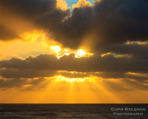 Sunbeams At Sunset Through The Clouds On The Oregon Coast Chris