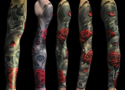 This tattoo includes a black and white inked lion's face with two roses below the lion. Sleeve skull red roses tattoo - Design of TattoosDesign of ...