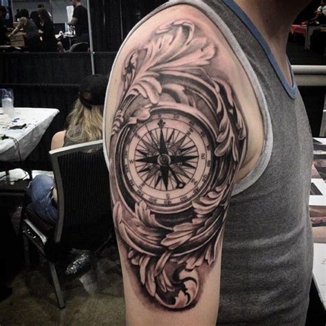 This simple black ink design is sure to make everybody do a double take. 120 Best Compass Tattoos for Men | Improb