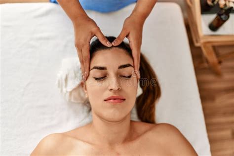 Two Women Therapist And Patient Having Facial Massage Session At Beauty