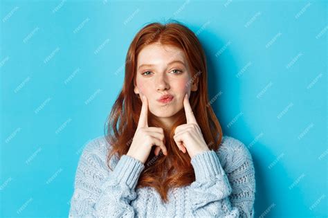 Premium Photo Close Up Of Cute Redhead Girl In Sweater Pucker Lips