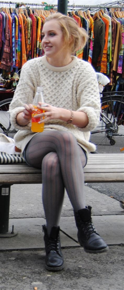 Grey Stripped Pantyhose On Crossed Legs Caught In The Streetwoman In