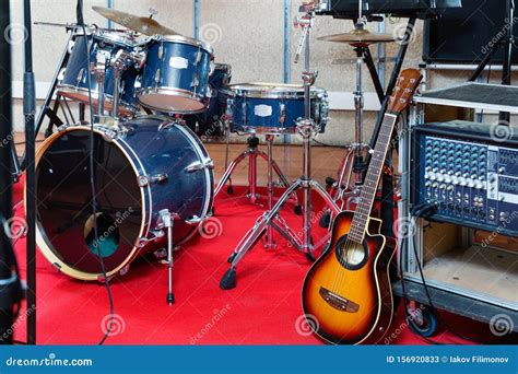 Set Of Musical Instruments Ready For Rehearsal Of Music Band In Modern