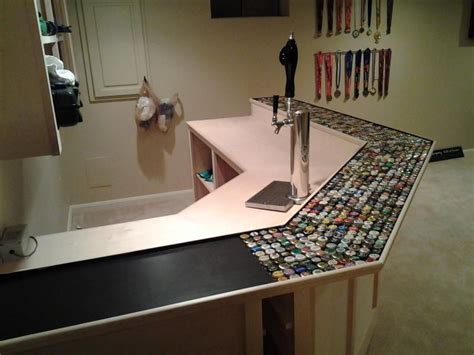 How to build a bottle cap bar top and a bottle cap table top with epoxy resin. Beer bottle cap bar top http://cdn.homebrewtalk.com ...